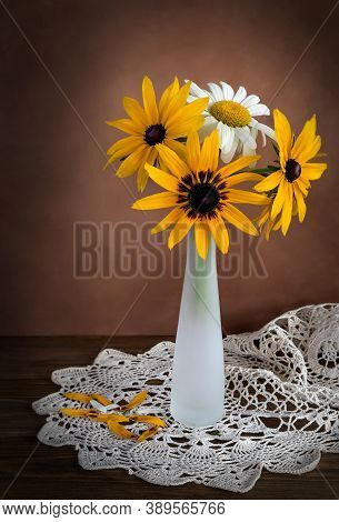Hamomile Flowers Yellow And White On The Background Of A Knitted Napkin Still Life