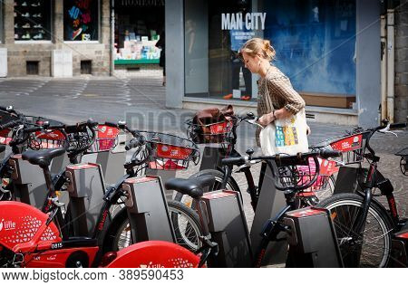 Lille, France - July 18, 2013. French Woman Using A Free Rental Bike In Lille, France