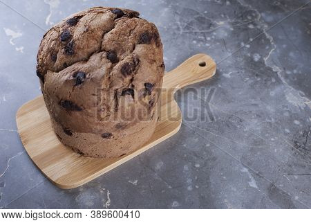 Christmas Chocolate Cake Panettone On A Marble Table, Soft Light, Top View, Also Know As Chocotone P
