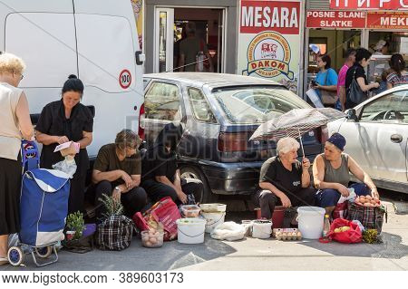 Nis, Serbia - September 3, 2018: Senior Old Women In Black Clothes Selling Agricultural Products, Fo