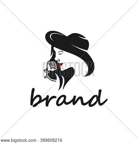 Woman With A Hat Holding A Rose