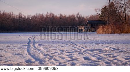 Frozen Pond Lit With Pink Sunset Sun Rays In Unionville, Markham, Ontario, Canada