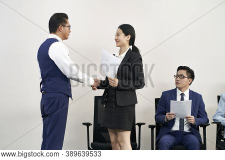 Asian Job Seeker Shaking Hands With Interviewer From Hr Department