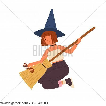 Cute Girl In Witch Hat Sitting And Combing Broom. Young Female Magician Or Wizard Portrait. Funny So