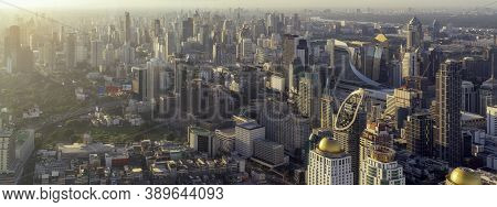 Ponorama For Cityscape Of Morning Sunrise In Bangkok City, Thailand With High Building And City