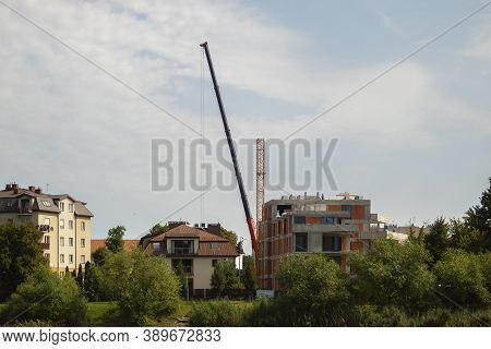 Dismantling And Assembling A Construction Crane. Dismantling A Tower Crane With Another Crane. Speci