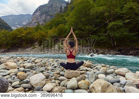 Yoga Classes In Nature. The Concept Of Playing Sports Alone. Social Exclusion. A Woman Does Yoga On 