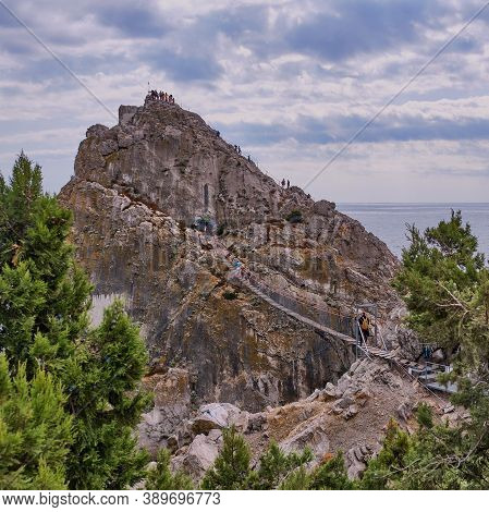 Coastal Seascape Landscape. Rock Diva, The Black Sea Coast Near Yalta, Town Simeiz, Crimea. People W