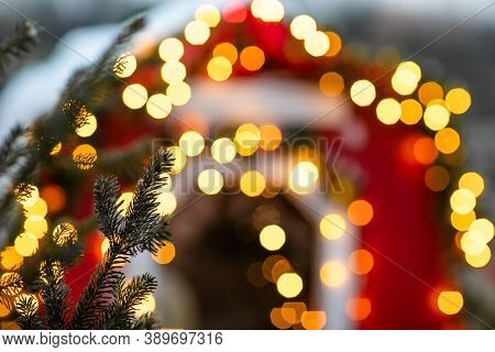 Christmas Winter Street With Tree And Festive Bokeh Lighting, Blurred Holiday Background