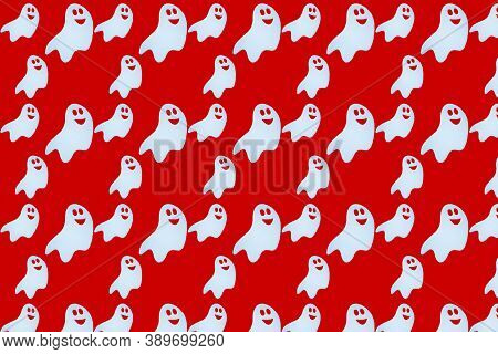 Cute Ghost On A Red Background.pattern Seamless For Halloween.