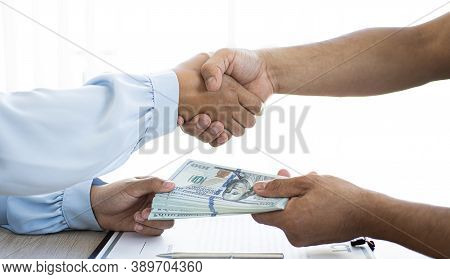 Shaking Hands With Congratulations On An Evil Plan, Businessmen Give Dollars To Bribe Employees In S