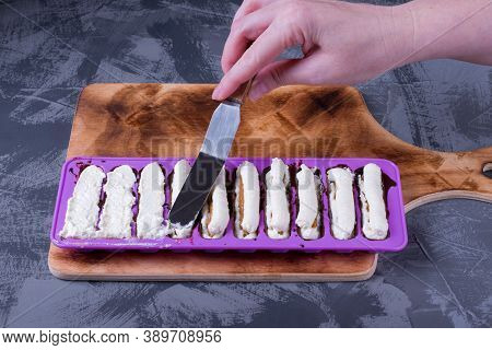 Step By Step Recipe To Make Chocolate Glazed Cottage Cheese Bars. Flattening The Curds Filling In Th