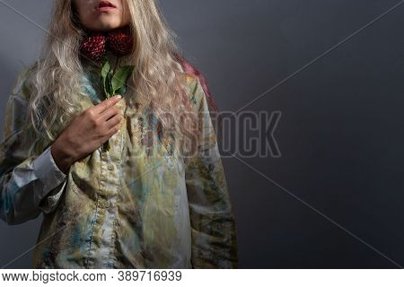 Sore Throat Concept. The Girl Holds Red Flowers At Her Throat. Sore Throat With Angina, Pharygitis, 