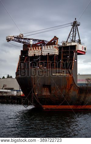 North Vancouver, British-columbia / Canada - 09/24/2020: A Large Container Ship Is Docked At Seaspan