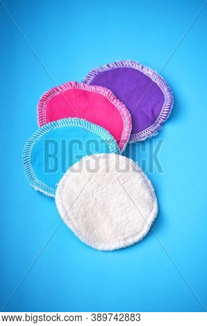 Four organic cotton reusable washable zero waste cleaning pads for make up removal in white blue pur