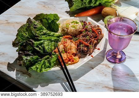 Korean Beef Bulgogi Ssambap Lettuce Wraps With Spicy Kimchi And Gochujang Hot Sauce