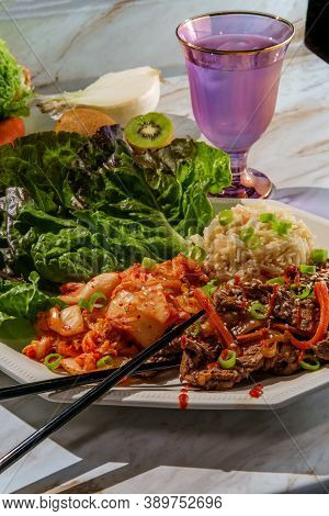 Korean Beef Bulgogi Ssambap Lettuce Wraps With Spicy Kimchi And Gochujang Hot Sauce