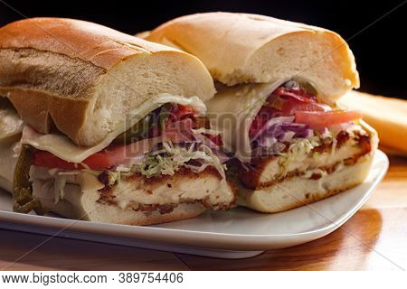 Italian-american Chicken Fried Steak Sandwich Hogie With Shredded Lettuce Tomato Hot Peppers And Red