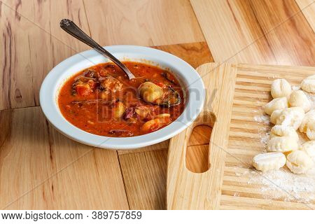 Italian Cuisine Sausage Gnocchi Soup With Tomato Basil Broth