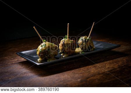 Delicious Swedish Meatballs With Sauce On Rustic Wooden Table