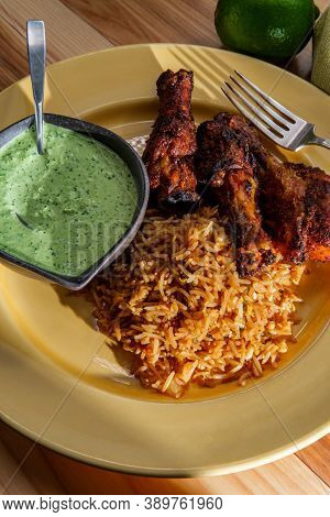 Peruvian Chicken Legs With Aji Verde Green Cilantro Sauce And Fried Rice