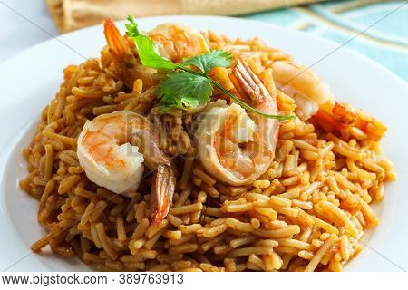 Tail-on Shrimp Spanish Rice With Vermicelli Pasta On Marble Kitchen Table