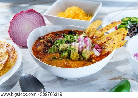 Mexican Beef Taco Soup With Pinto Beans And Garnishes