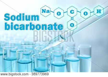 Text Sodium Bicarbonate With Soda Formula And Test Tubes On Background