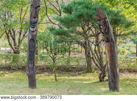 Chilgapsan, South Korea; October 2, 2020: For Editorial Use Only. Two Wooden Korean Totem Poles In F