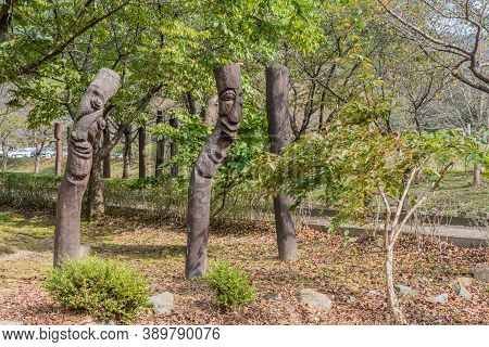 Chilgapsan, South Korea; October 2, 2020: For Editorial Use Only. Two Wooden Korean Totem Poles In F