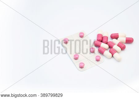 Medicine Pink Pills In Tablet And Capsul On White Background With Space For Text. Medicine For Heal