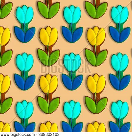 Tulips Pattern On A Pastel Yellow Background. Gingerbread Cookies In The Form Of Flowers. Colorful C