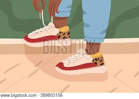 Woman Legs In Trendy Sneakers With White, Red Colors And Leopard Print. Female Dark Skinned Feet In 
