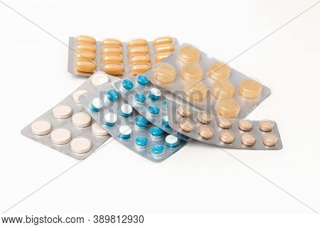 Close Up Different Pills In Blisters On White Table. Prophylaxis Against Flu