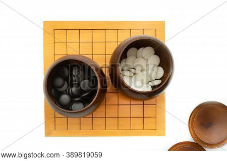 weiqi broad game, baduk, igo - play with black and white stone on the broad