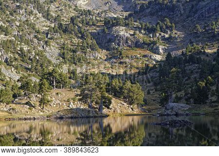 Sun Rises On The Shorelines Of Lac Acahrd, A Well-known Mountain Lake In Chamrousse Range