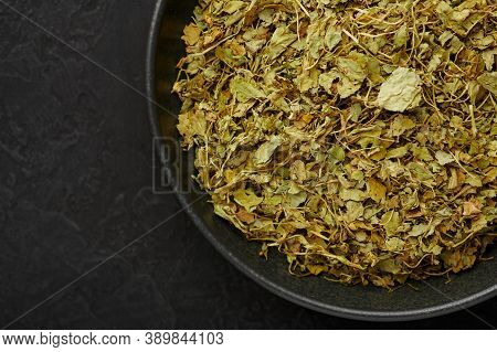 Dry Kasuri Methi Or Fenugreek In Black Bowl On Dark Slate Table Top. Dried Fenugreek Is Is The Popul