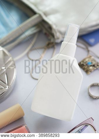 Mockup White Bottle Of Hand Sanitizer Surrounded With Things From Woman Purse. Vertical Shot About H