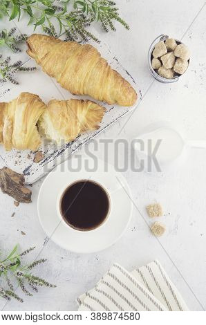 Croissants, A Cup Of Coffee With A Slice Of Natural Chocolate, Milk And Cane Organic Unrefined Sugar