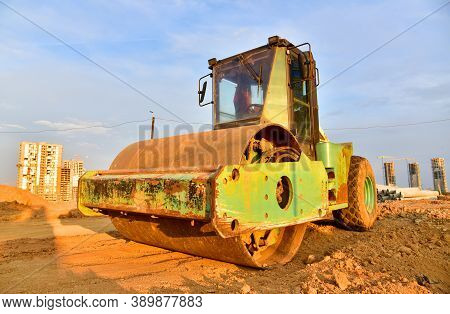 Vibro Roller Soil Compactor Leveling Ground At Construction Site. Vibration Single-cylinder Road Rol