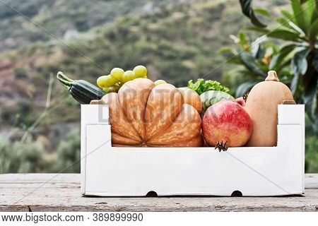 White Box With Autumn Fruits On Hature Background. Delivery Food O Food Donation Concept. Donation B