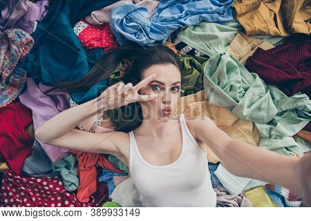 High Angle Above Photo Of Lovely Lady Home Spring Cleaning Lying Many Clothes Stack Floor Prepared U