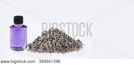 Essential Organic Lavender Oil In Glass Bottle With Dried Flowers - Lavandula