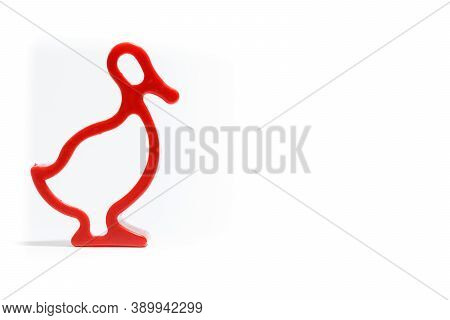 Plastic Form For Baking On White Background. Isolated. Red Plastic Duck Form.