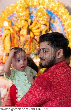 Kolkata, West Bengal, India - 6th October 2019 : A Beautiful Boy Kid Is Wondering While Father Holds