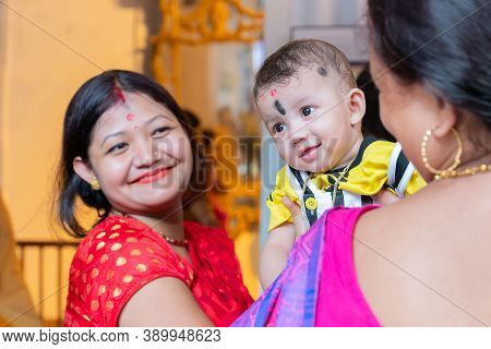 Kolkata, West Bengal, India - 6th October 2019 : A Beautiful Boy Kid Smiling In Joy While Mother Hol
