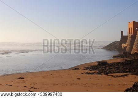 Beautiful Sandy Beach In Sunny Day With Calm Waves. Perfect Landscape For Summer Vacation And Holida