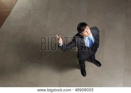 Young businessman with his eyes closed