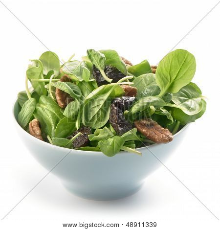 fresh tatsoi salad with pekan nuts and prunes