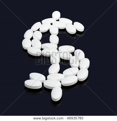 White Tablets Spelling Dollar Sign